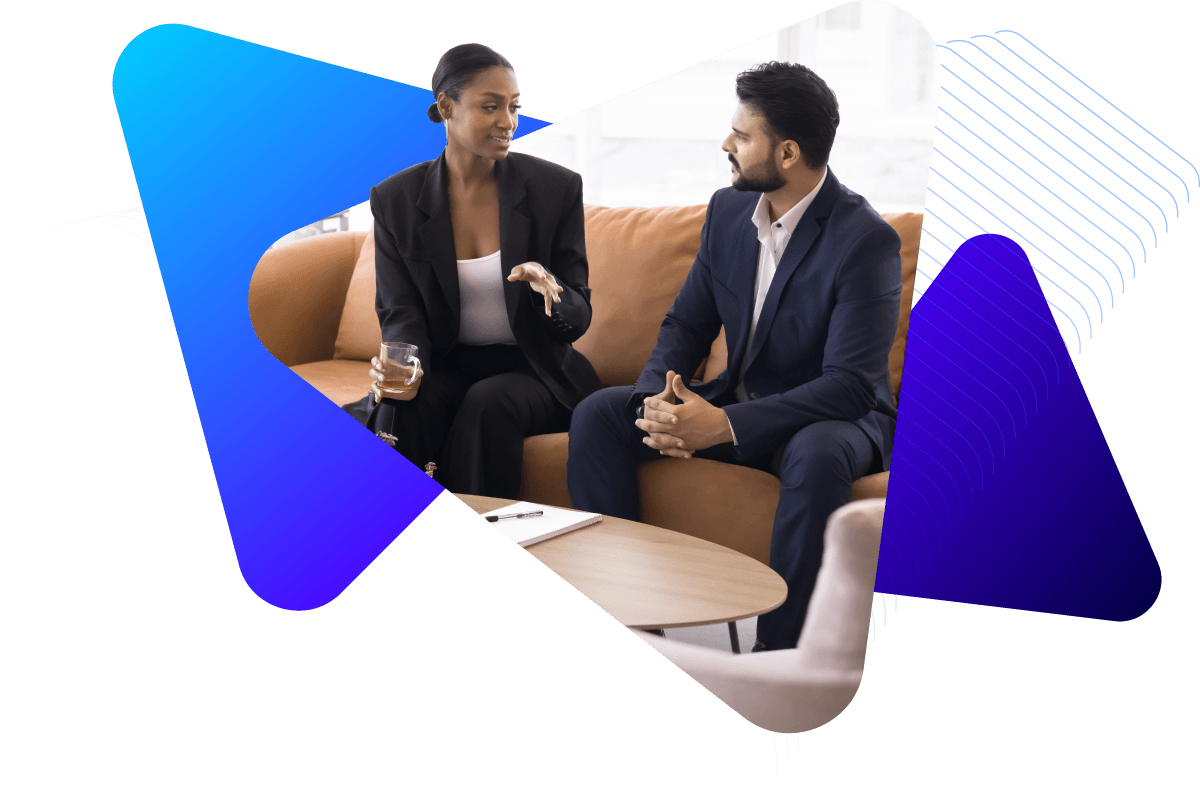 Two business professionals having a casual conversation.