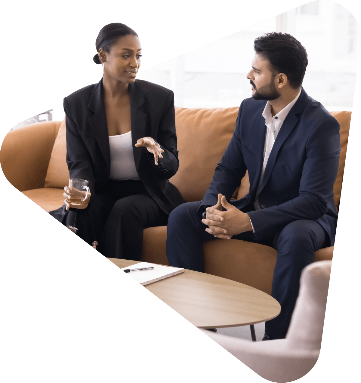 Two business professionals having a casual conversation.