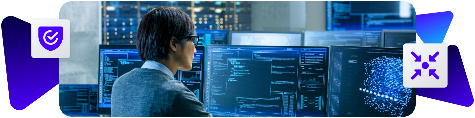 Developer viewing multiple screens in office with compliance icons.